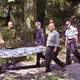 Forensics workers remove the bodies of a married couple murdered in a copycat crime officials derided as "perfunctory and derivative."